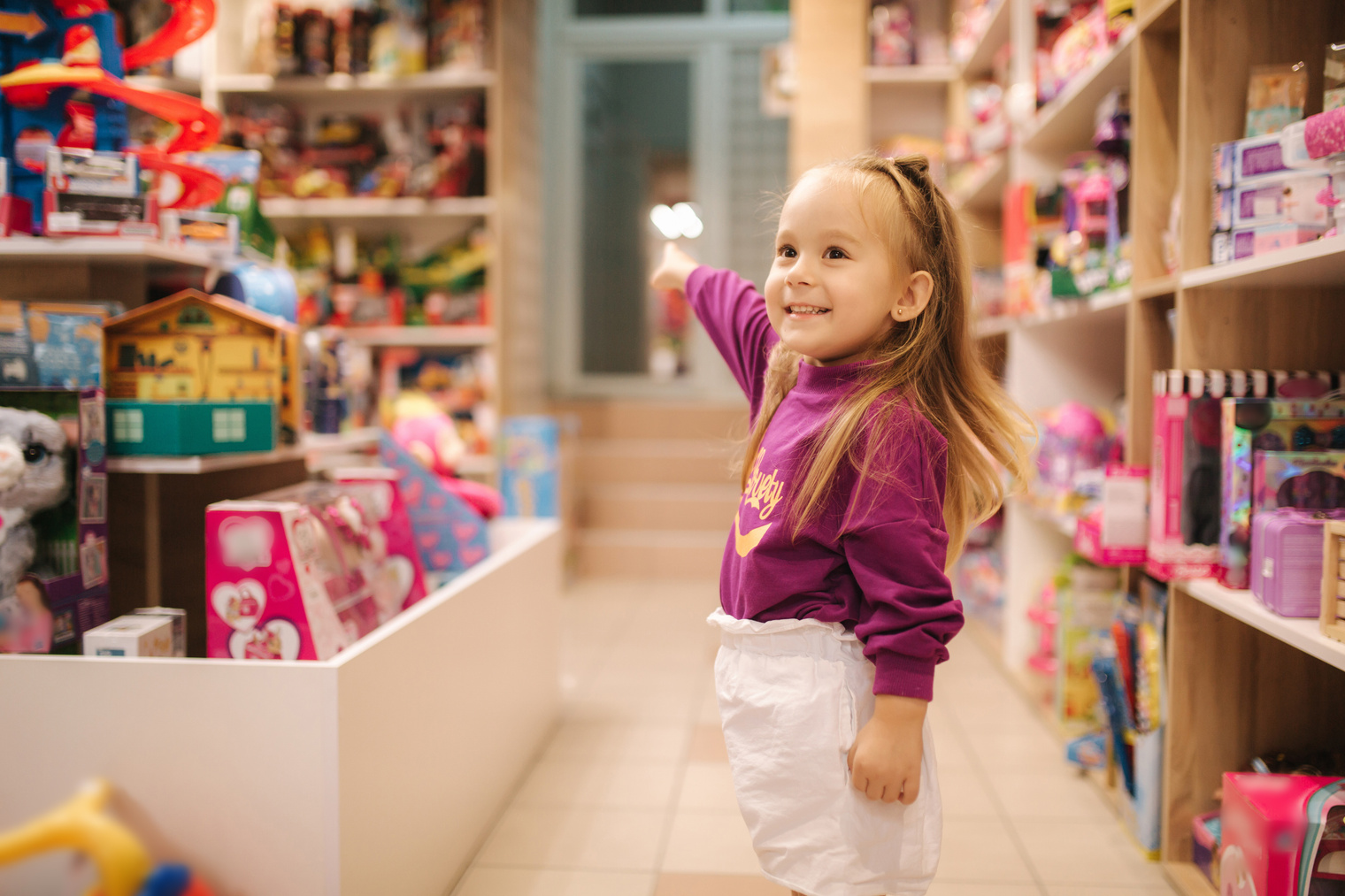 A child smiling inside a Toy Republic store