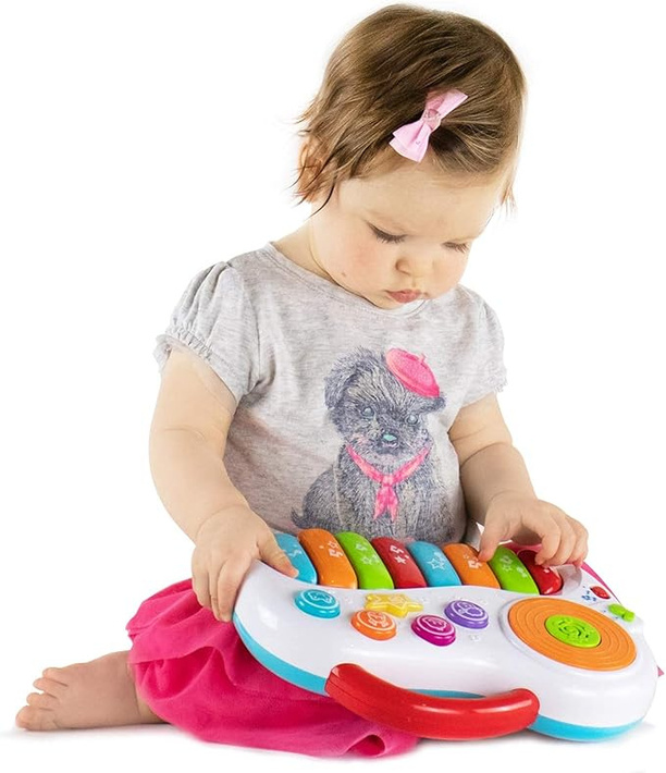 Child playing a toy piano